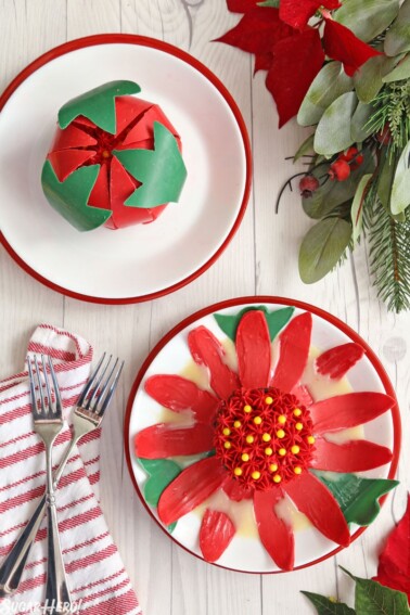 2 Blooming Chocolate Flowers on white plates; one is open and one is closed.