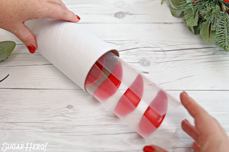 Blooming Chocolate Flowers - rolling up chocolate petals into a cardboard tube to create perfectly curved petals | From SugarHero.com