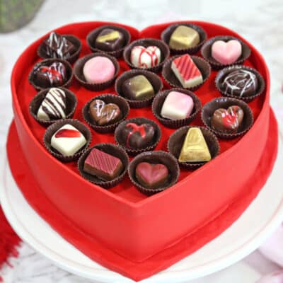 Box of Chocolates Cake on a white cake plate.