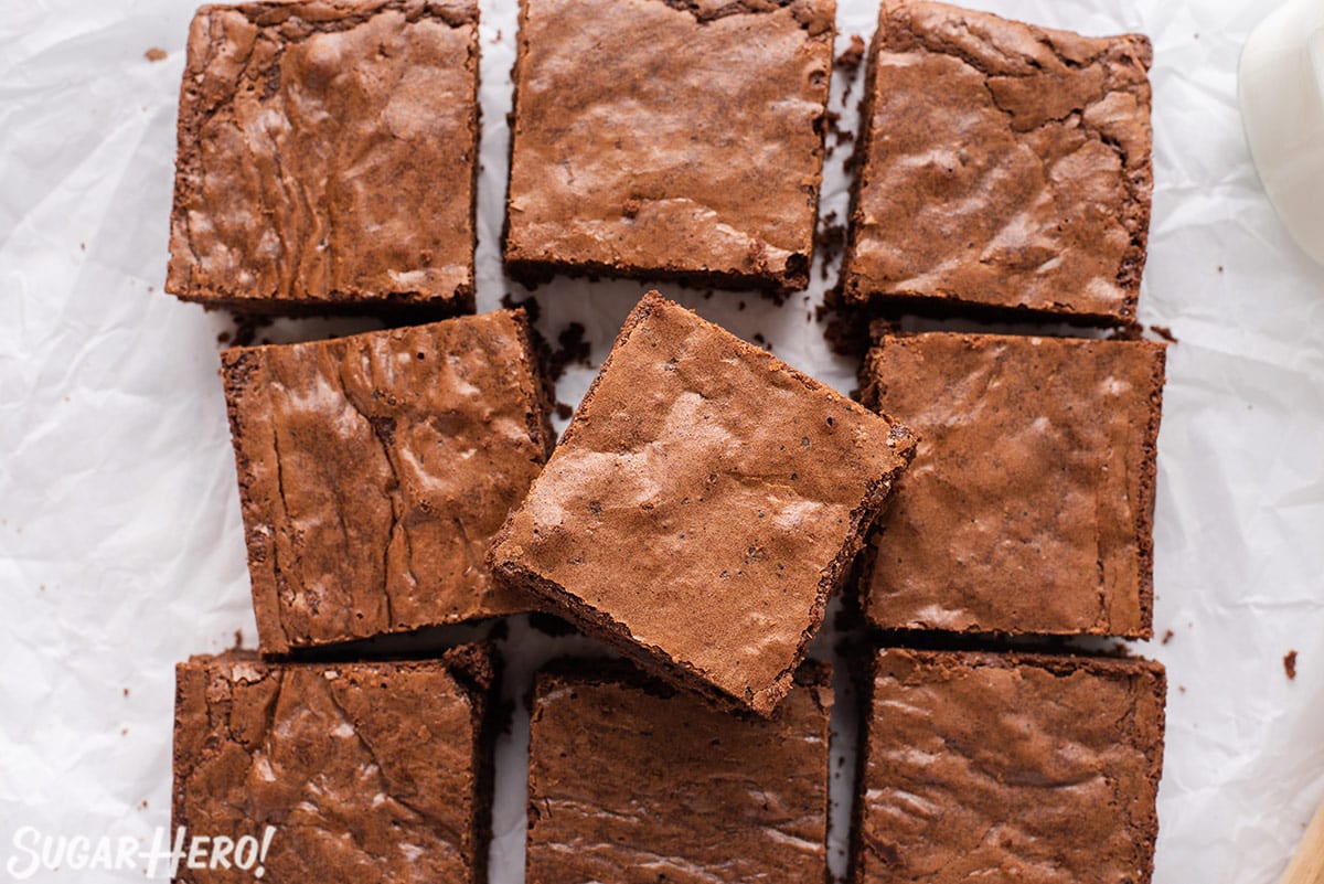 Pan of Brown Butter Brownies cut up on a wrinkled piece of parchment