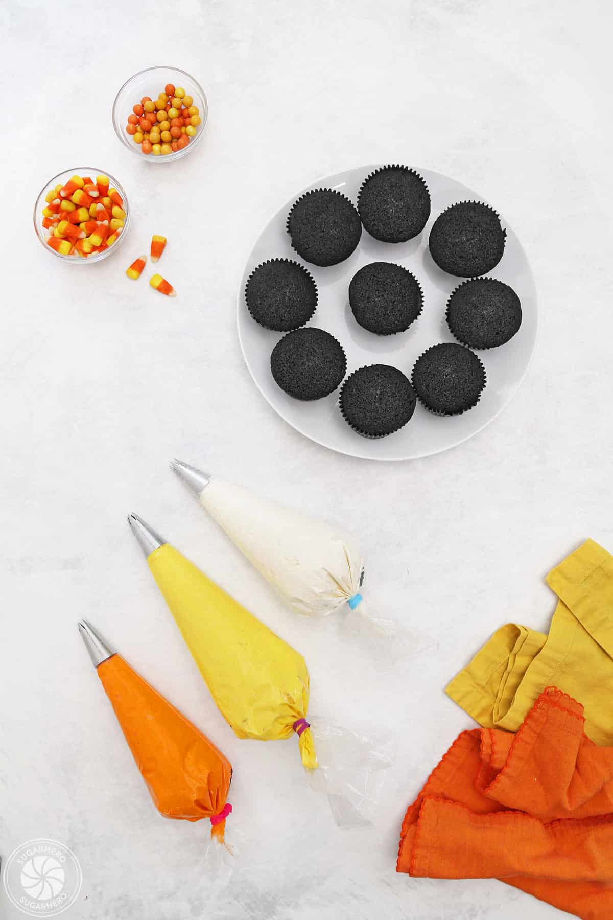Overhead shot of supplies needed to make Candy Corn Cupcakes.