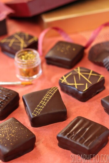 Assortment of Caramel Shortbread Squares on a red surface.