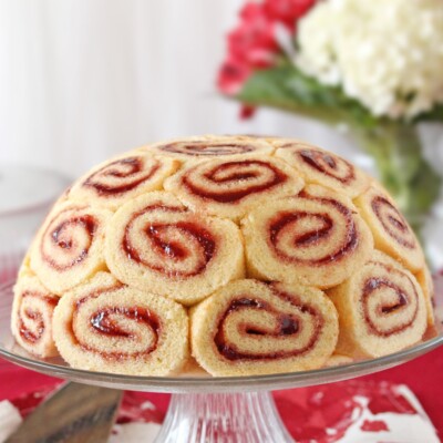 Charlotte Royale Cake on glass cake stand.