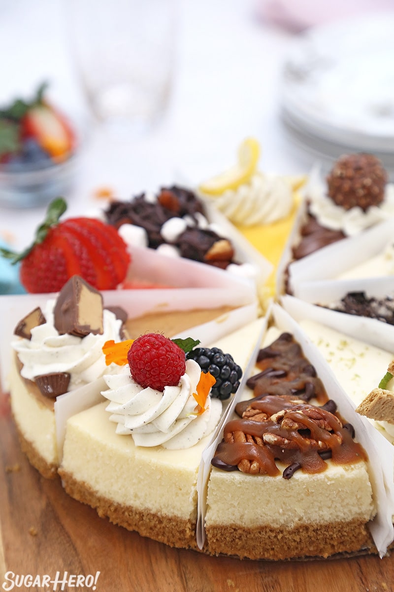 Half of a cheesecake sampler on a wooden platter.