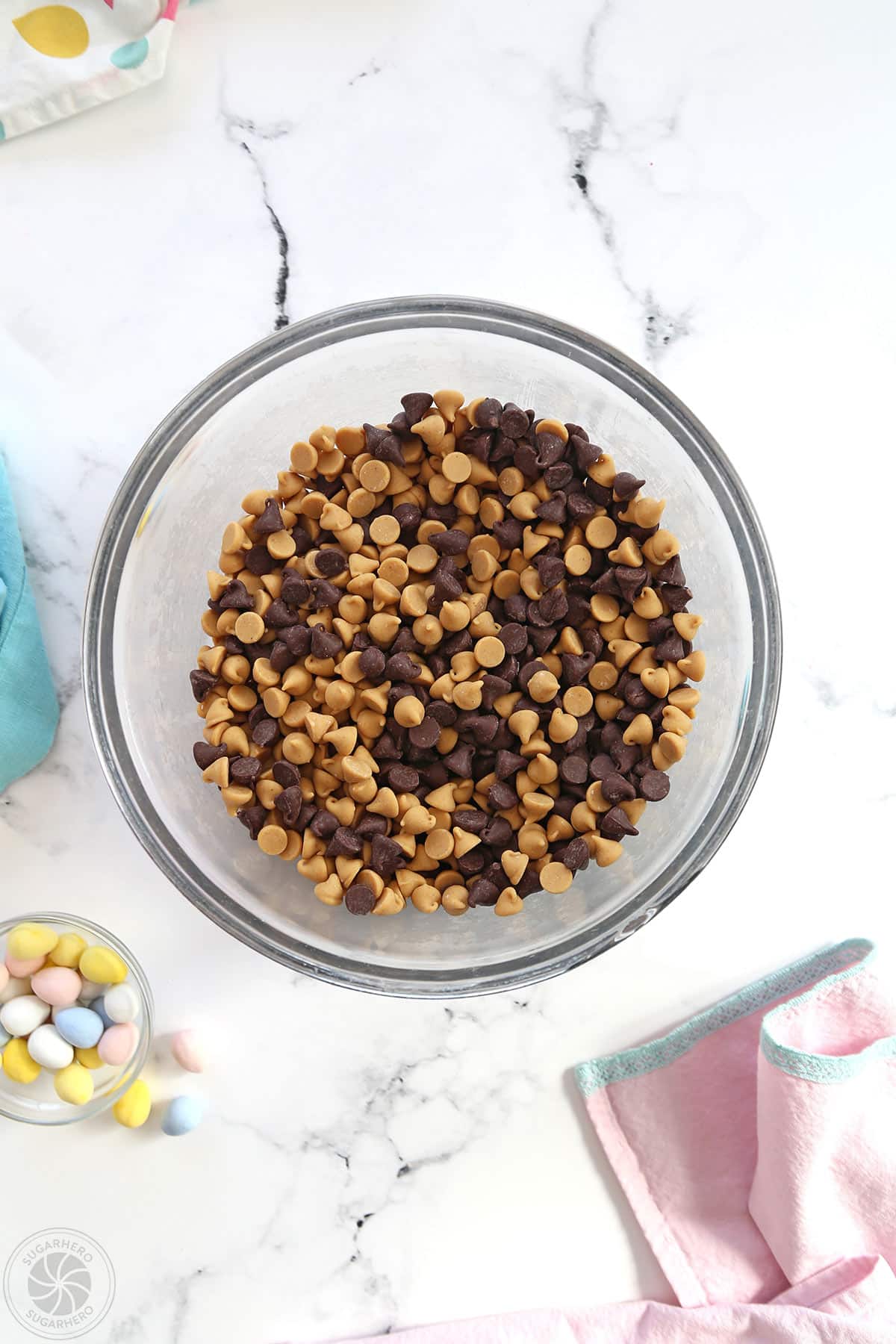 Peanut butter chips and chocolate chips mixed together in a large bowl.