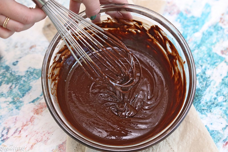 A photo of whisking chocolate orange brownie batter.