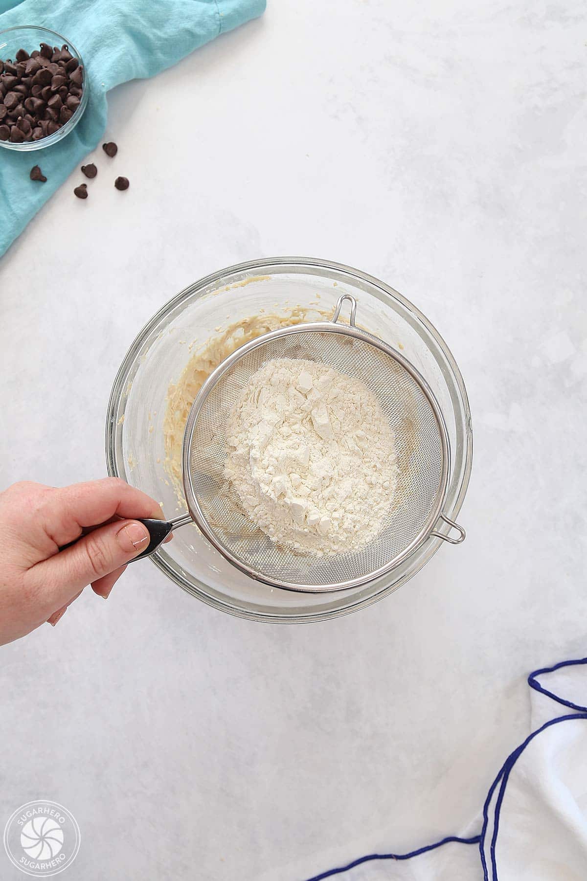 Sifting flour into the filling mixture.