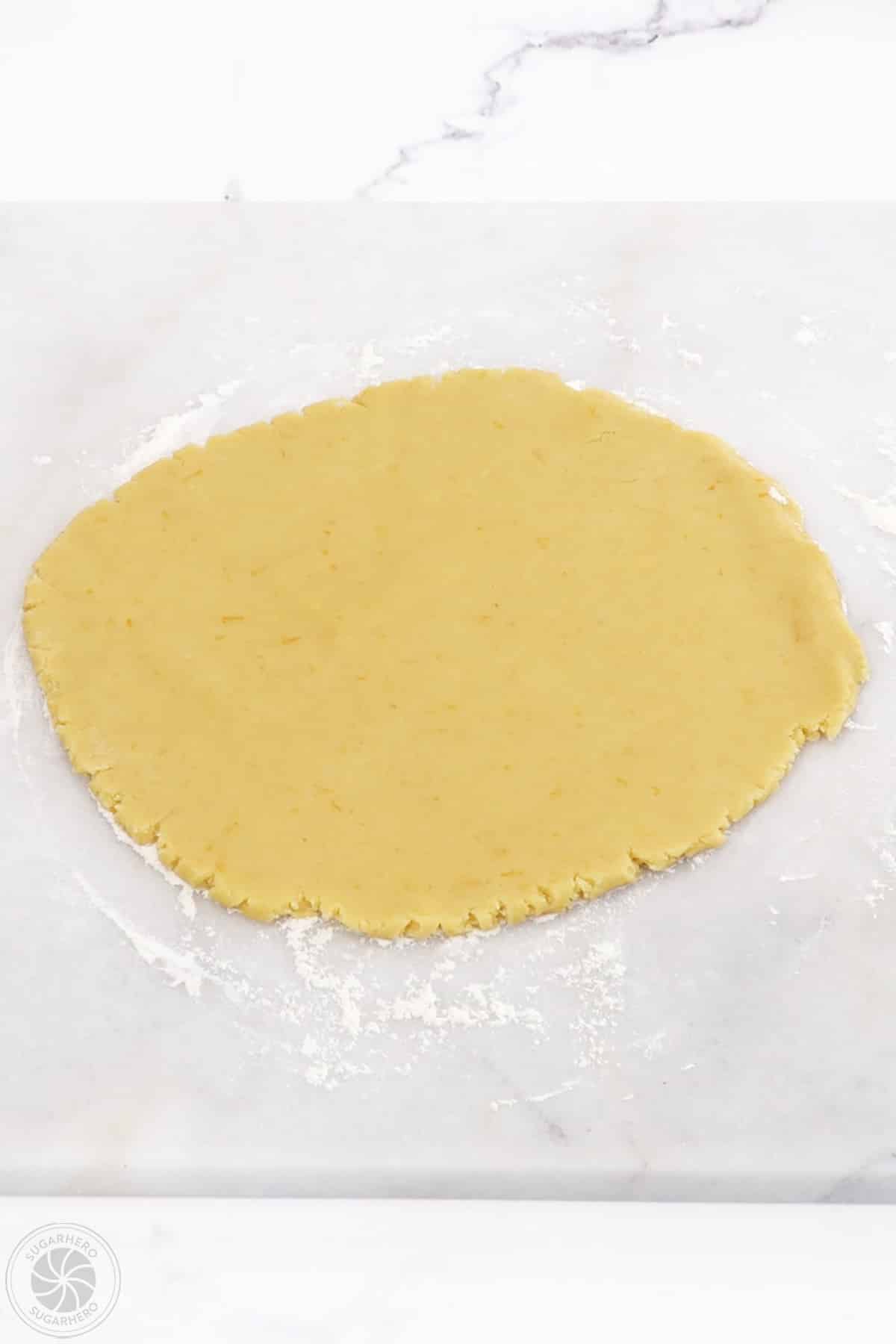 Dough for the cake layer rolled out into a circle.