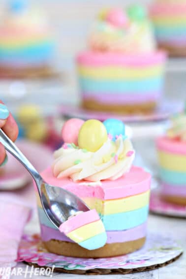 Easter no-bake mini cheesecake with a spoonful on a metal spoon in front of the cheesecake.
