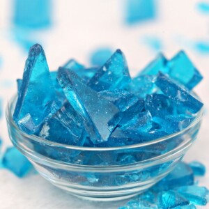 Blue rock candy in a glass bowl.