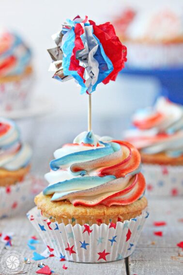 Close up of an Exploding Cupcake with a decorative toothpick.