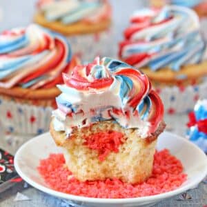 Close up of an Exploding Cupcake with a bit removed to show the pop rocks in the middle.
