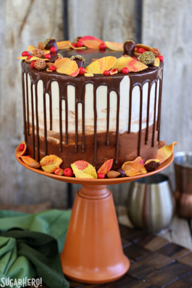 A Festive Fall Layer Cake on an orange cake stand.