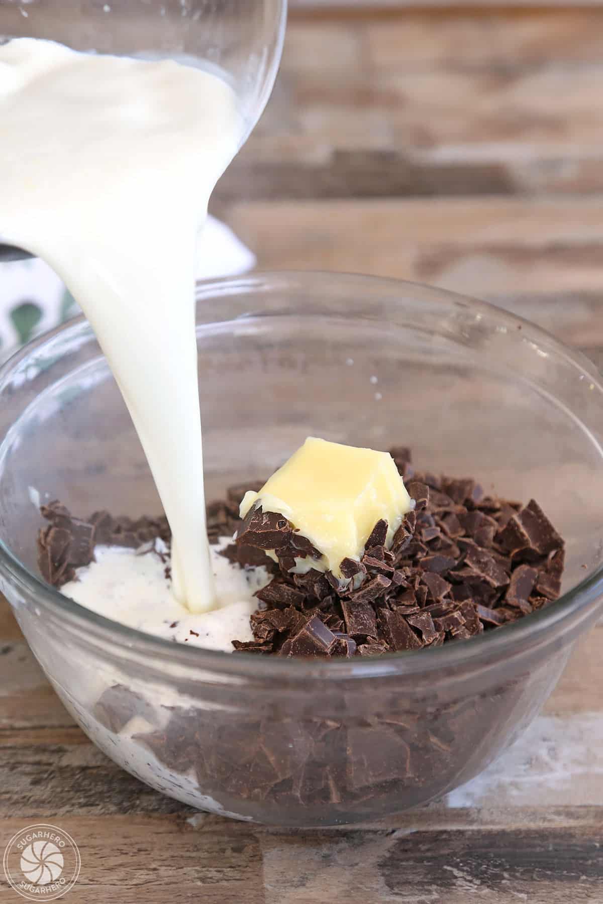Pouring hot cream into butter and chopped chocolate.