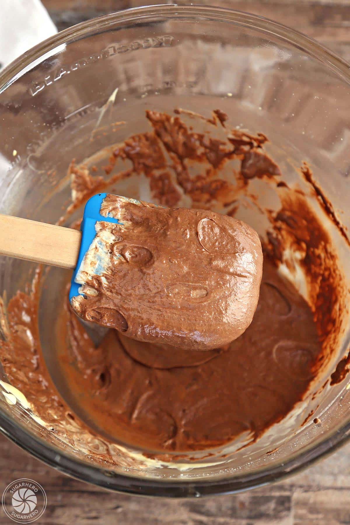 Just barely combined egg yolk and chocolate mixture on a spatula.