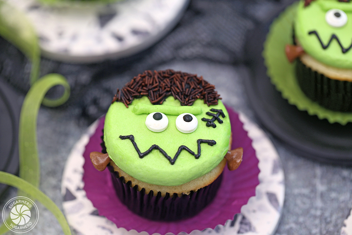 A Frankenstein Cupcake on a purple wrapper.