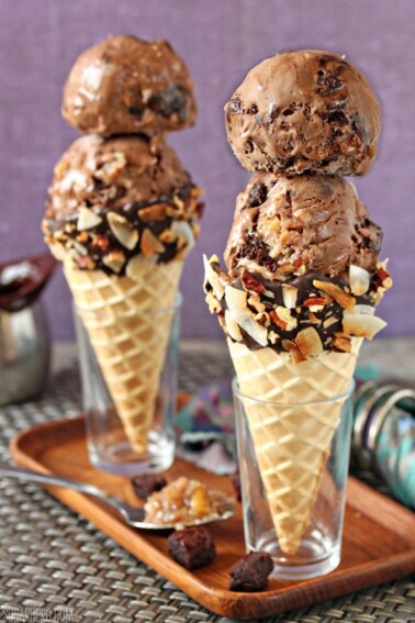 Two sugar cones with two scoops of German Chocolate Brownie Ice Cream in each.