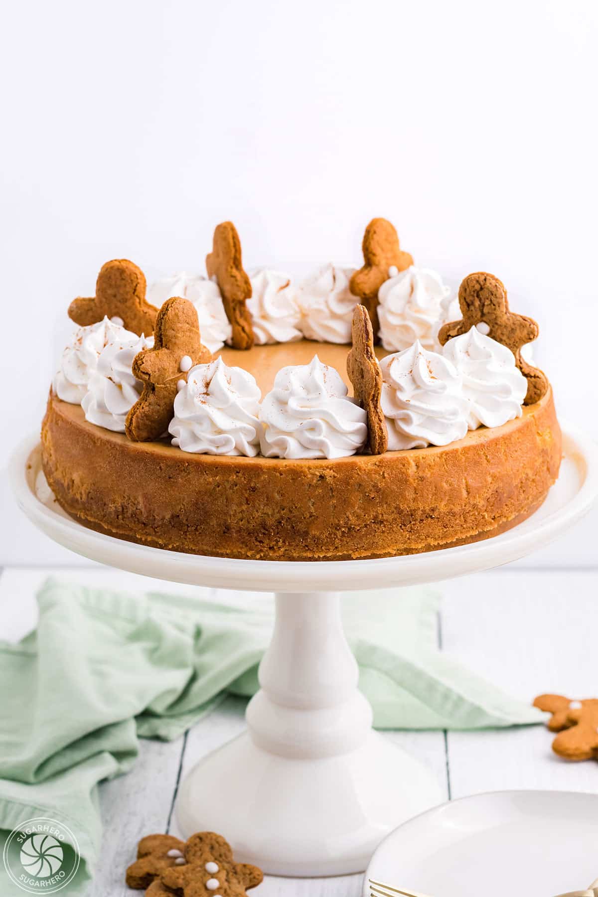 Gingerbread Cheesecake on a white cake plate.
