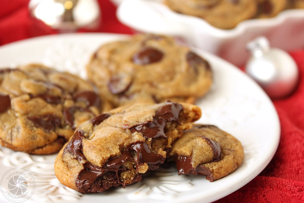 Plate of Gingerbread Chocolate Chip Cookies with one cookie broken in half.