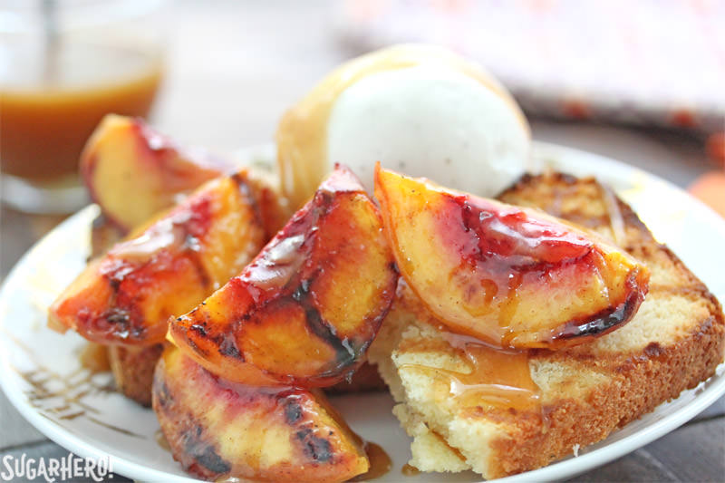 Grilled pound cake with grilled peaches, vanilla ice cream, and honey caramel sauce | From SugarHero.com