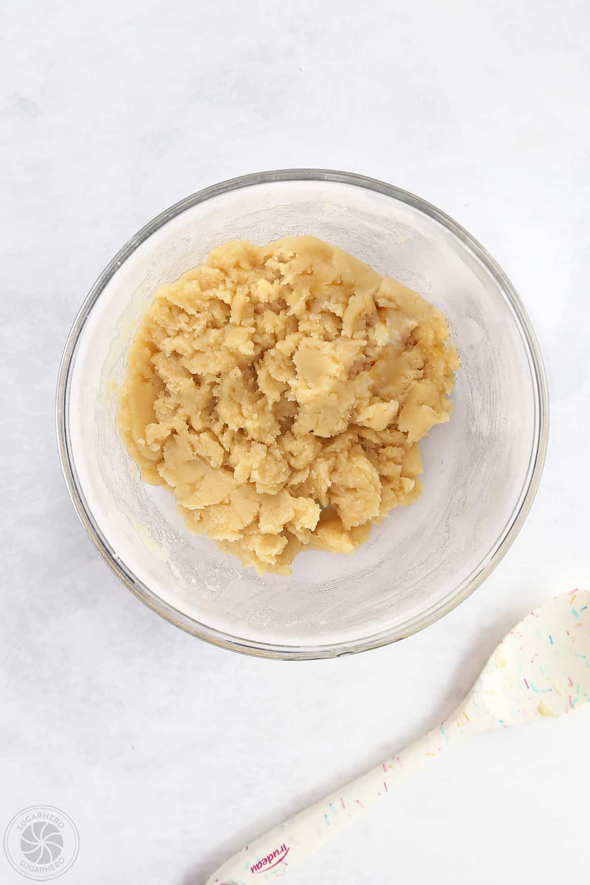 A mixing bowl with mixed crust dough.