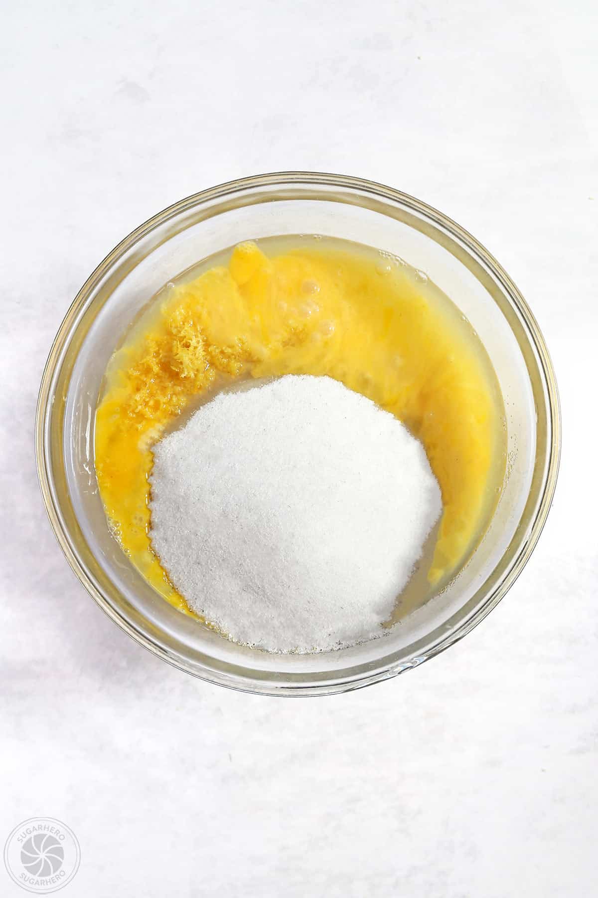 Ingredients for lemon bar filling in a clear mixing bowl.