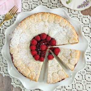 Top view of Linzer Cookie Cake with two slices cut out.