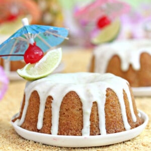 Close up of a Mai Tai Bundt Cake on a small white plate.