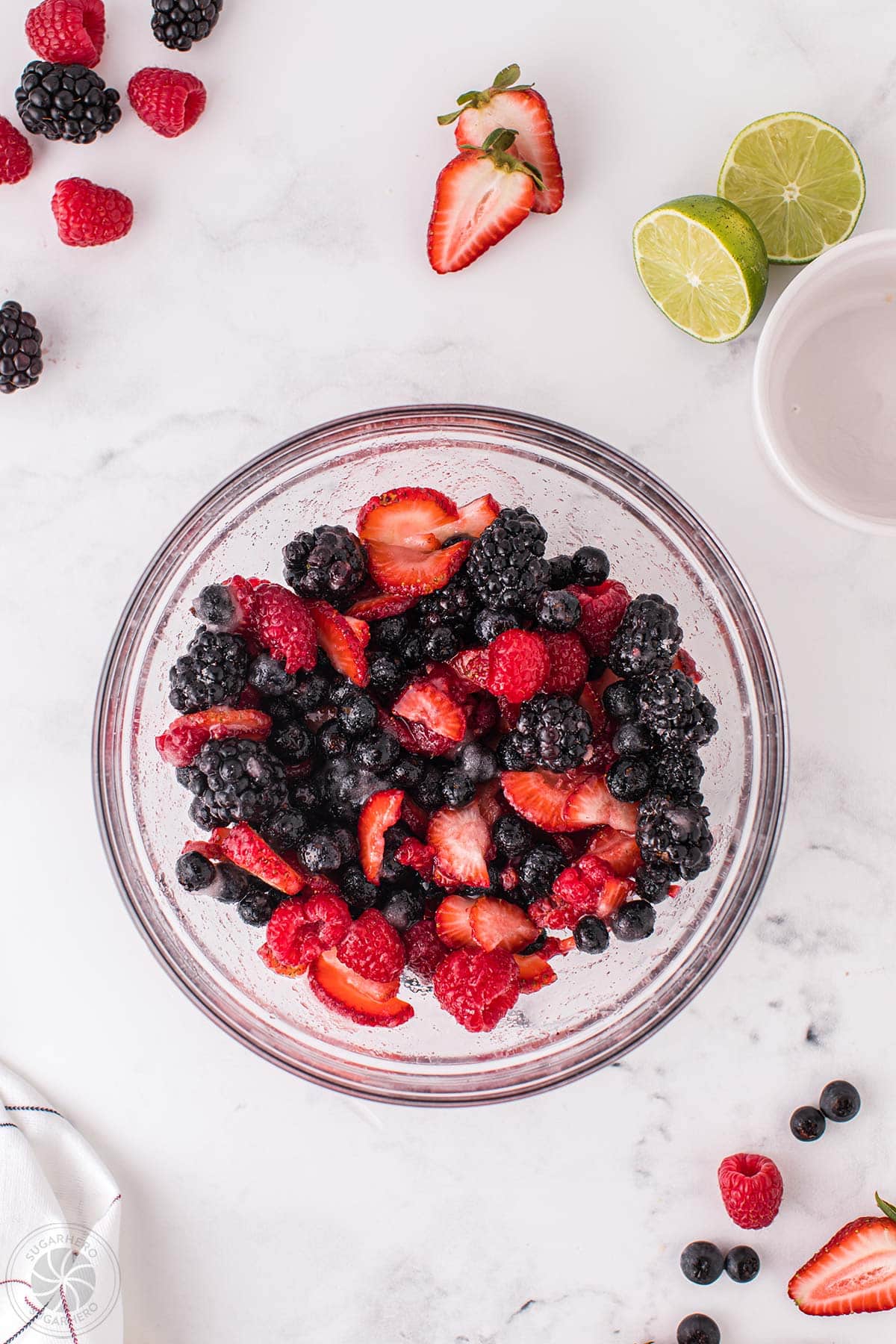 A bowl of mixed berries mascerating.