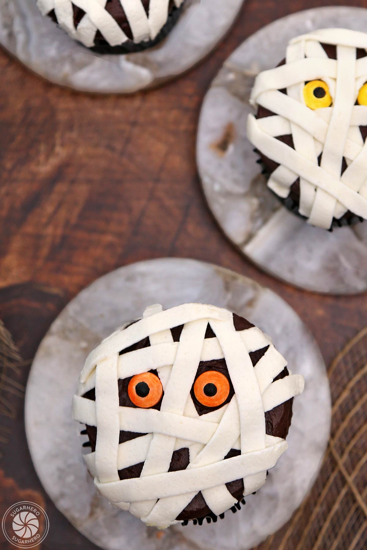 Close up of a Mummy Cupcake on a marble disc.