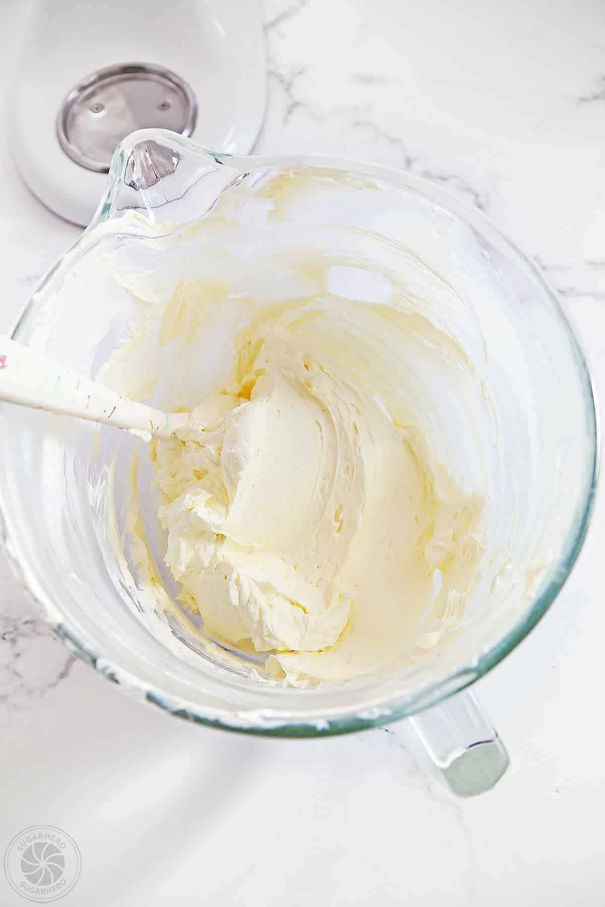 Whipped cream cheese in a mixer bowl.