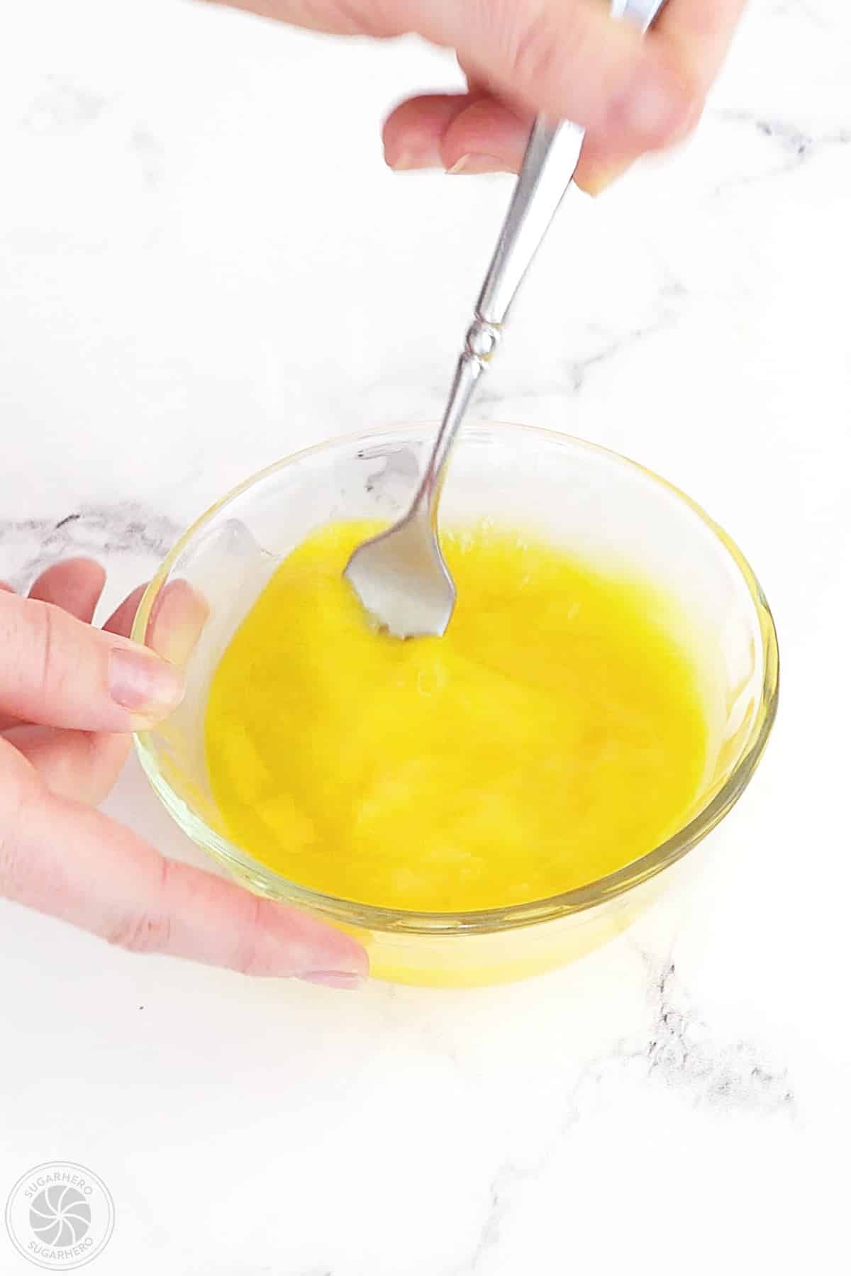 Whisked eggs in a small bowl.