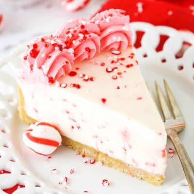 A slice of no-bake peppermint cheesecake on a white plate.