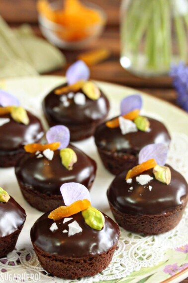 Nougat-Stuffed Brownie Bites on a floral plate and white doily.
