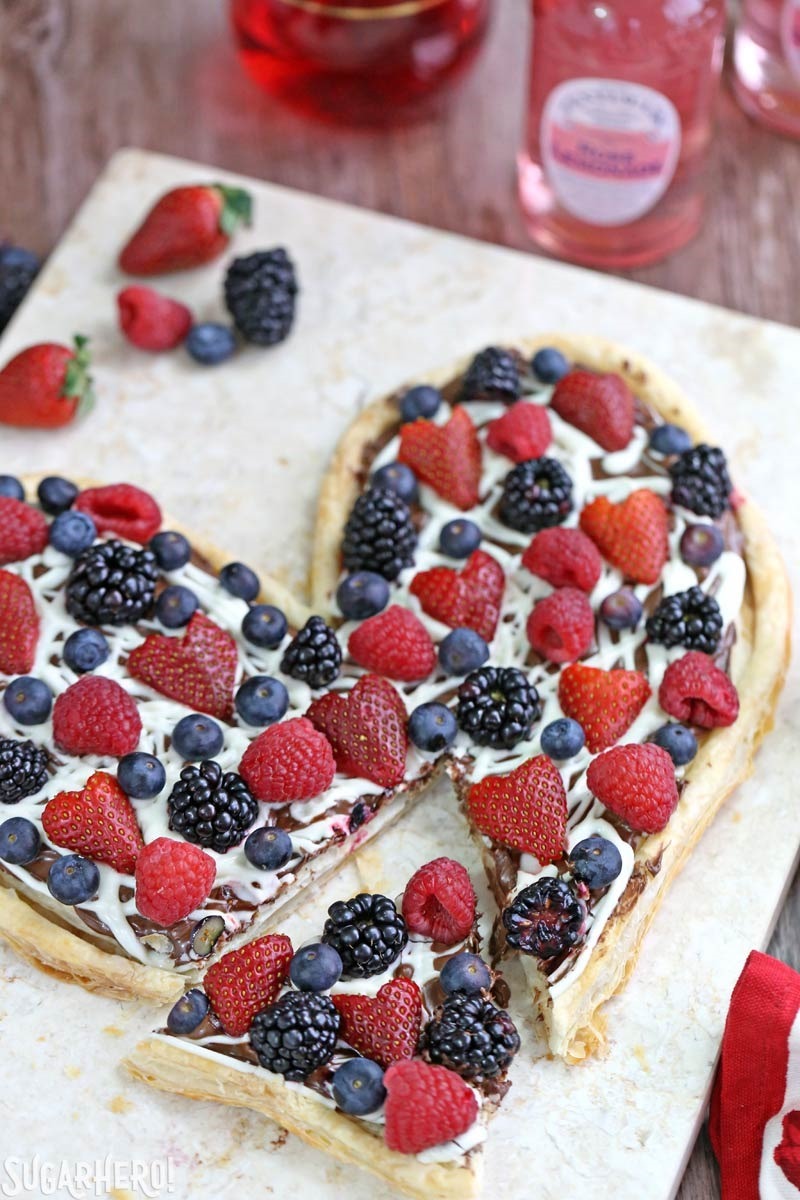Nutella Puff Pastry Pizza is easy and gourmet. You&rsquo;ll love the combination of buttery puff pastry, Nutella, white chocolate, and juicy fresh berries! | From SugarHero.com