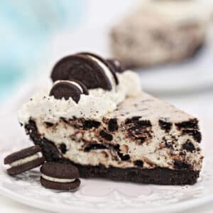 Slice of Easy No-Bake Oreo Pie on a white plate.