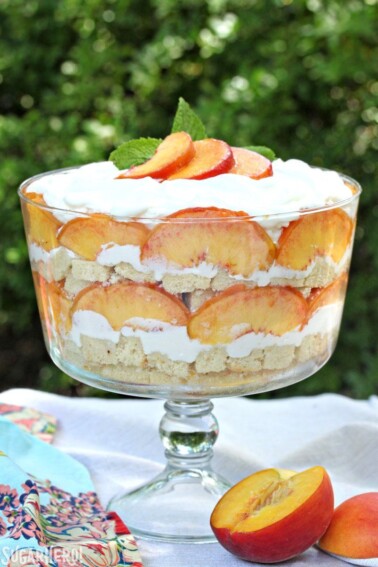 Close up of Peaches and Cream Trifle in a clear trifle bowl.