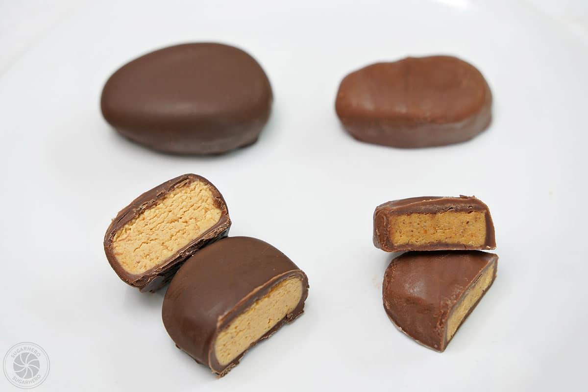 Two peanut butter eggs cut open to reveal the inside: a homemade egg on the left, and a store-bought egg on the right.