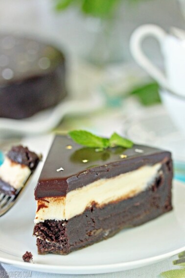 A slice of Peppermint Patty Flourless Chocolate Cake with a bite removed from the tip.