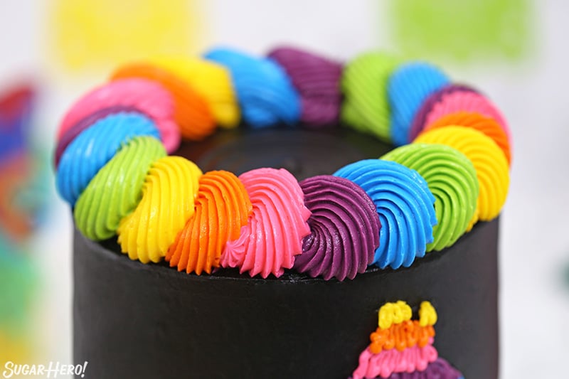 Close-up of a colorful neon buttercream border