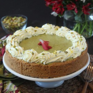Pistachio Pie with Lemon Whipped Cream on a white cake platter.