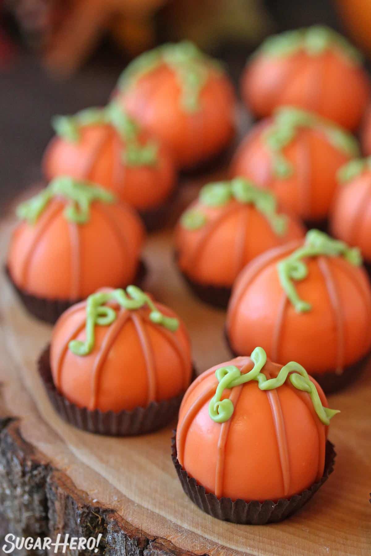 Close-up of Pumpkin Bread Truffles on a wooden serving plate.