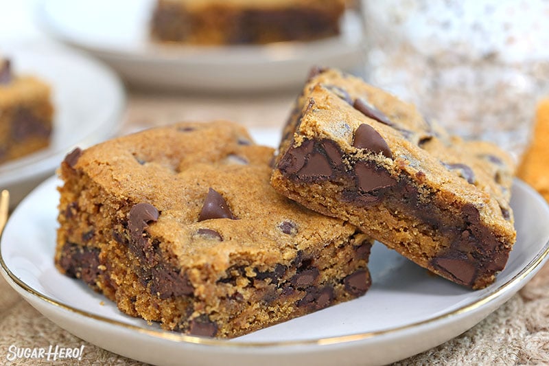 Close-up of Pumpkin Chocolate Chip Bars on a gold-rimmed white plate.