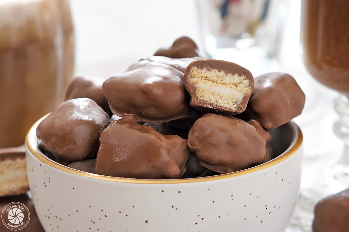 White bowl of Root Beer Float Pieces, with one cut open to show the interior.