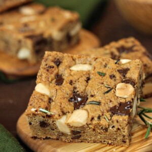Rosemary Almond Blondies on a wooden cutting board.