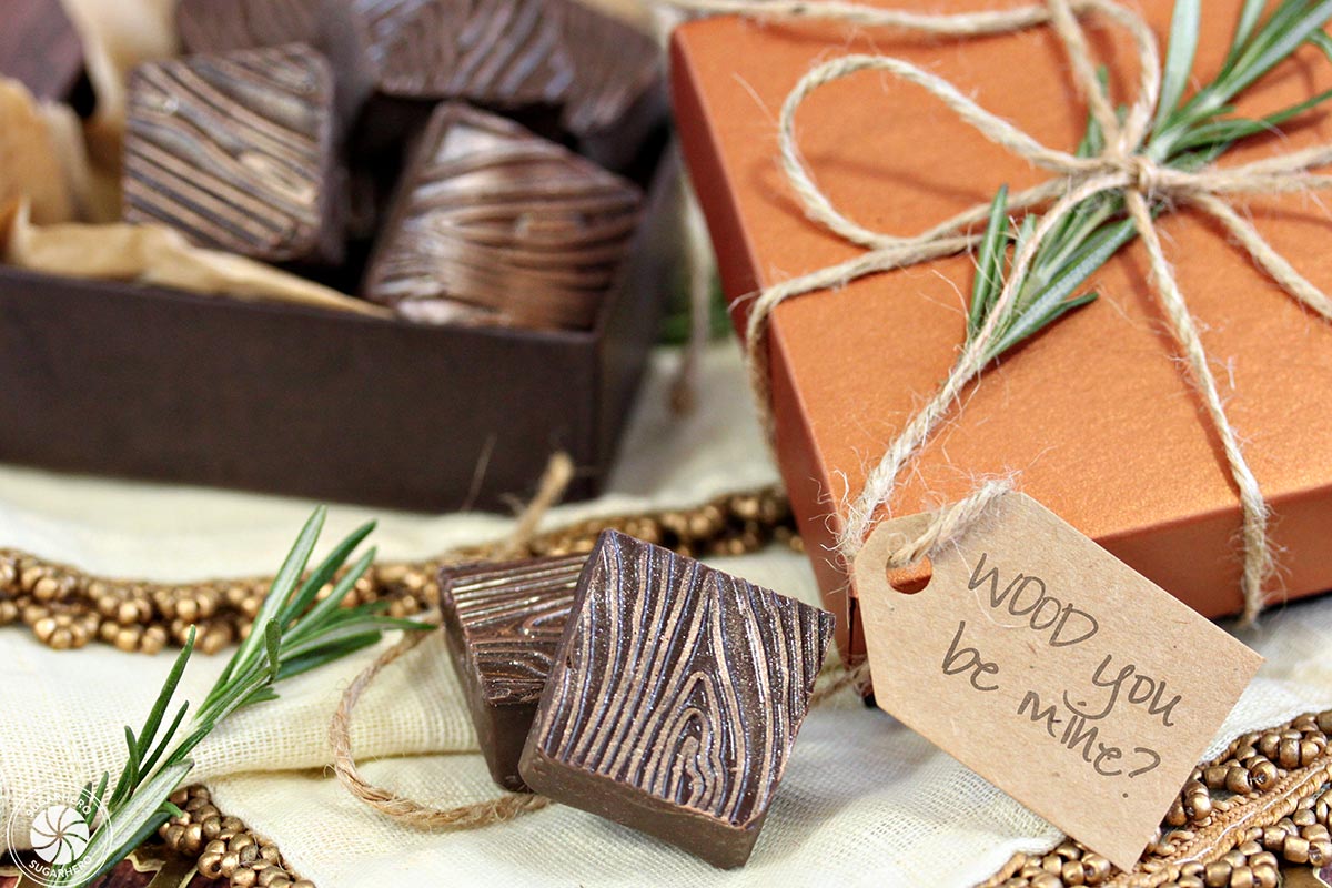 Rosemary Raspberry Truffles - square chocolate truffles with a wood grain pattern, in a decorative candy box with a "Wood you be mind?" tag | From SugarHero.com