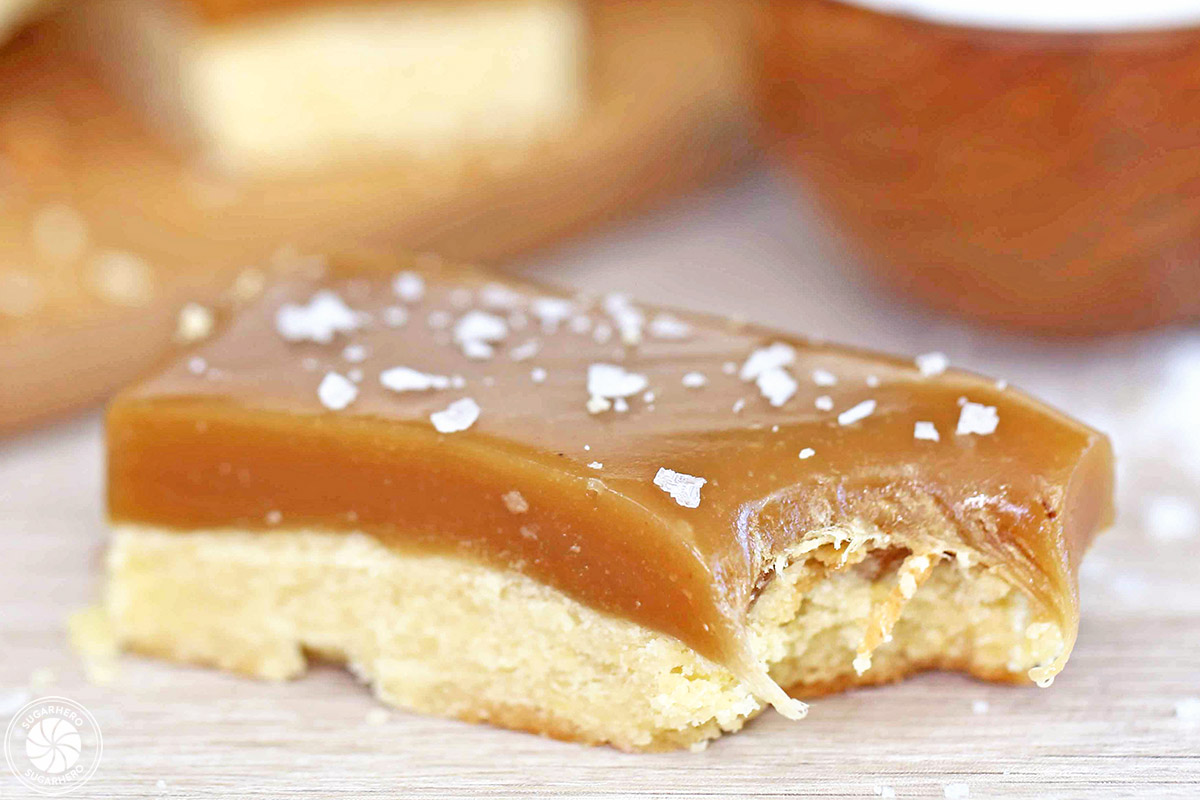 Single Salted Caramel Bar with a bite taken out to show the texture.