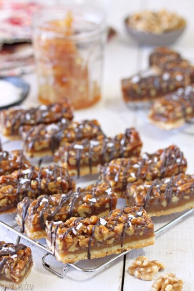 Cut Salted Honey Walnut Bars on a wire rack.