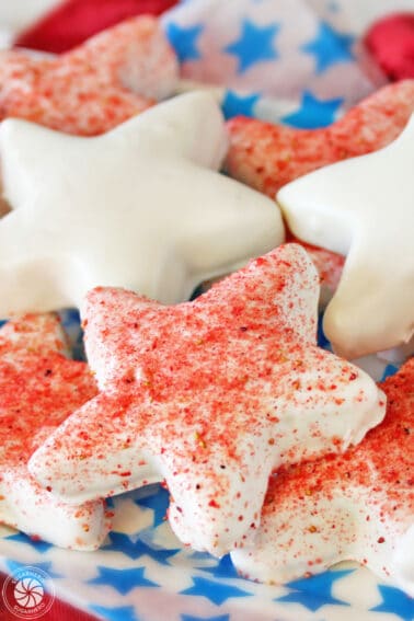 Close up of a pile of Strawberry-Dusted Shortbread Stars.