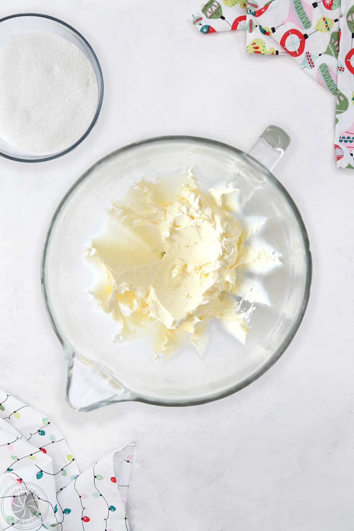 Creamed butter and cream cheese mixture in a glass mixing bowl.